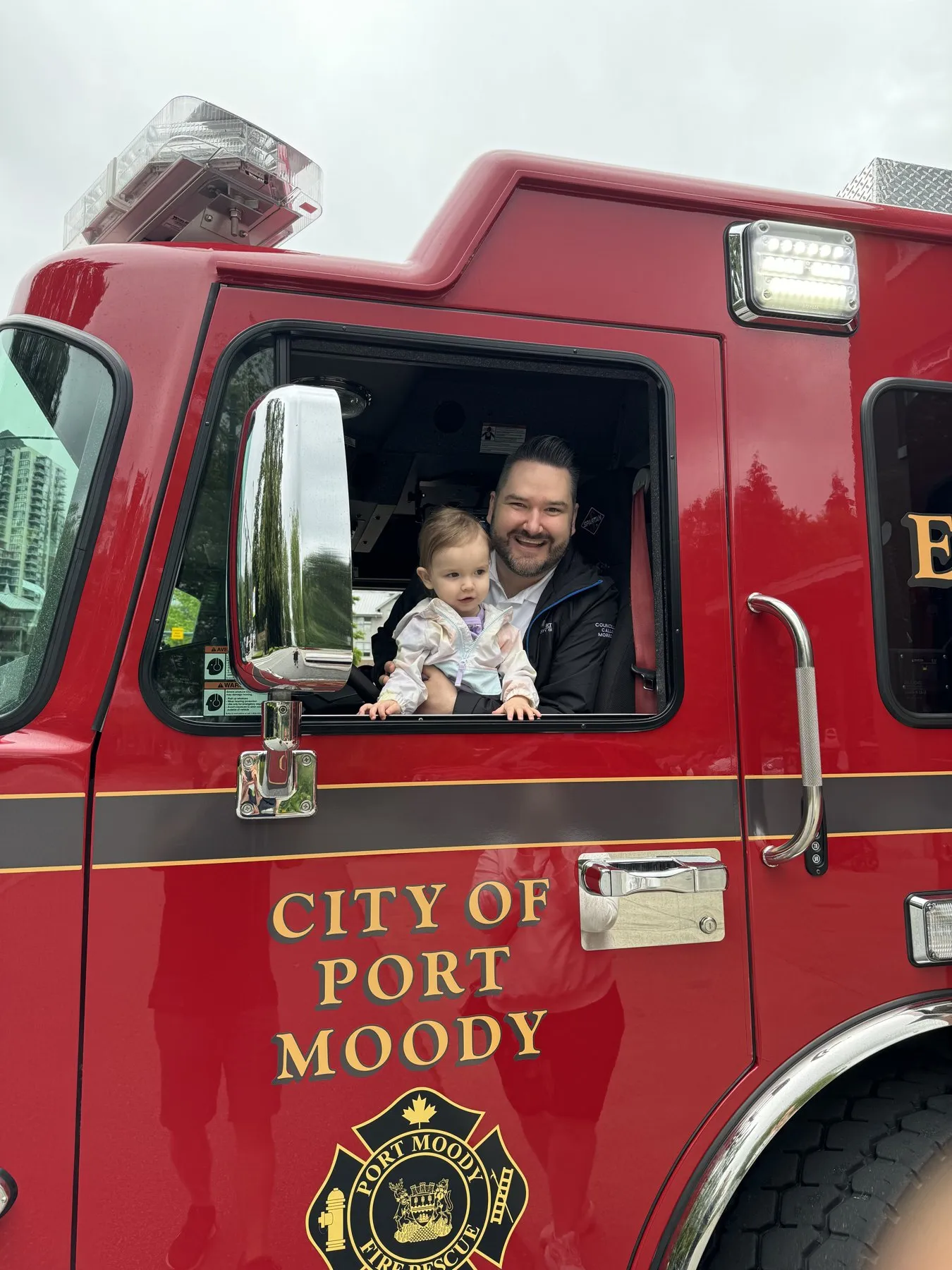 Kids exploring a City of Port Moody fire truck.