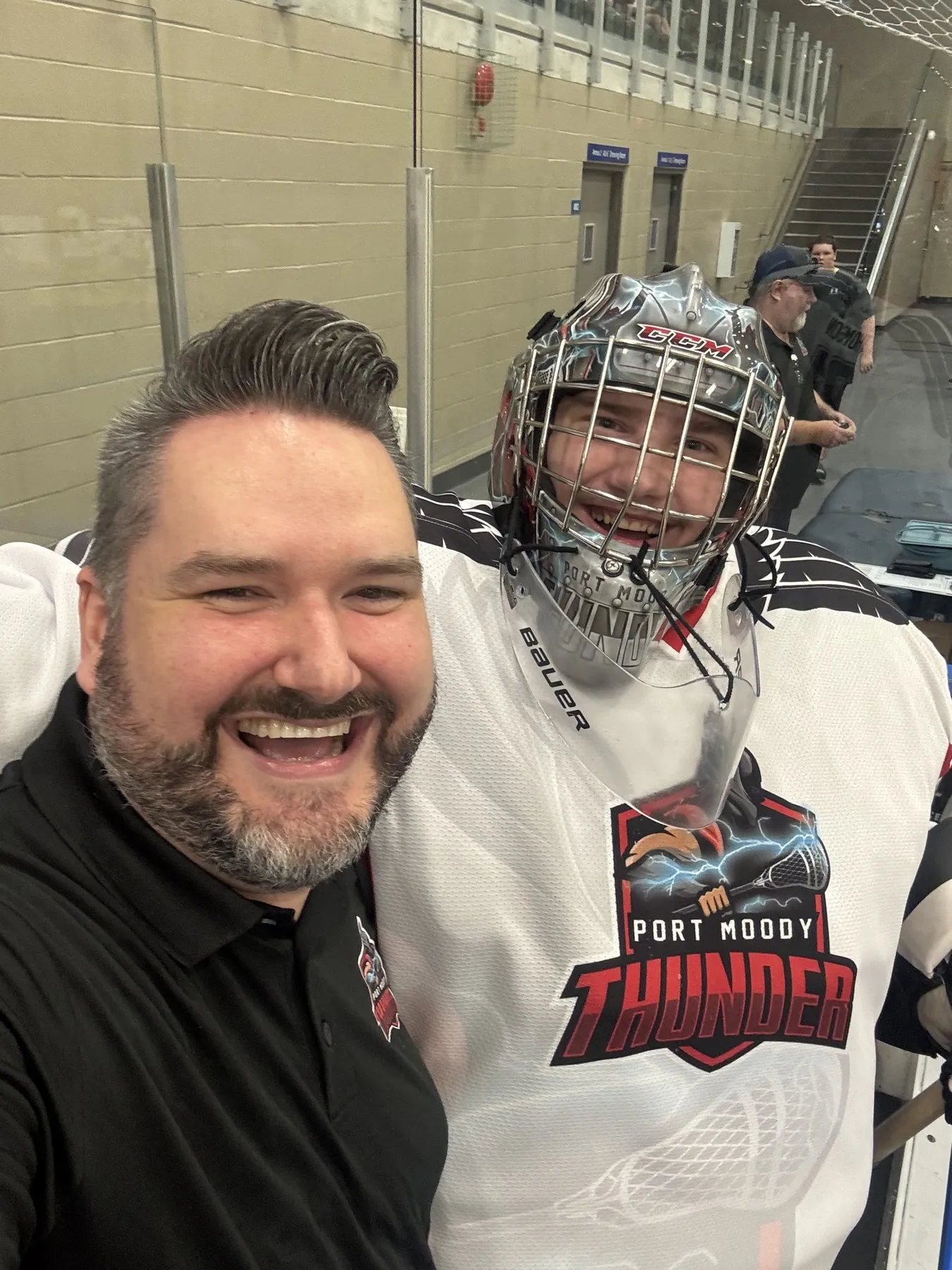 Callan Morrison with a young hockey player.